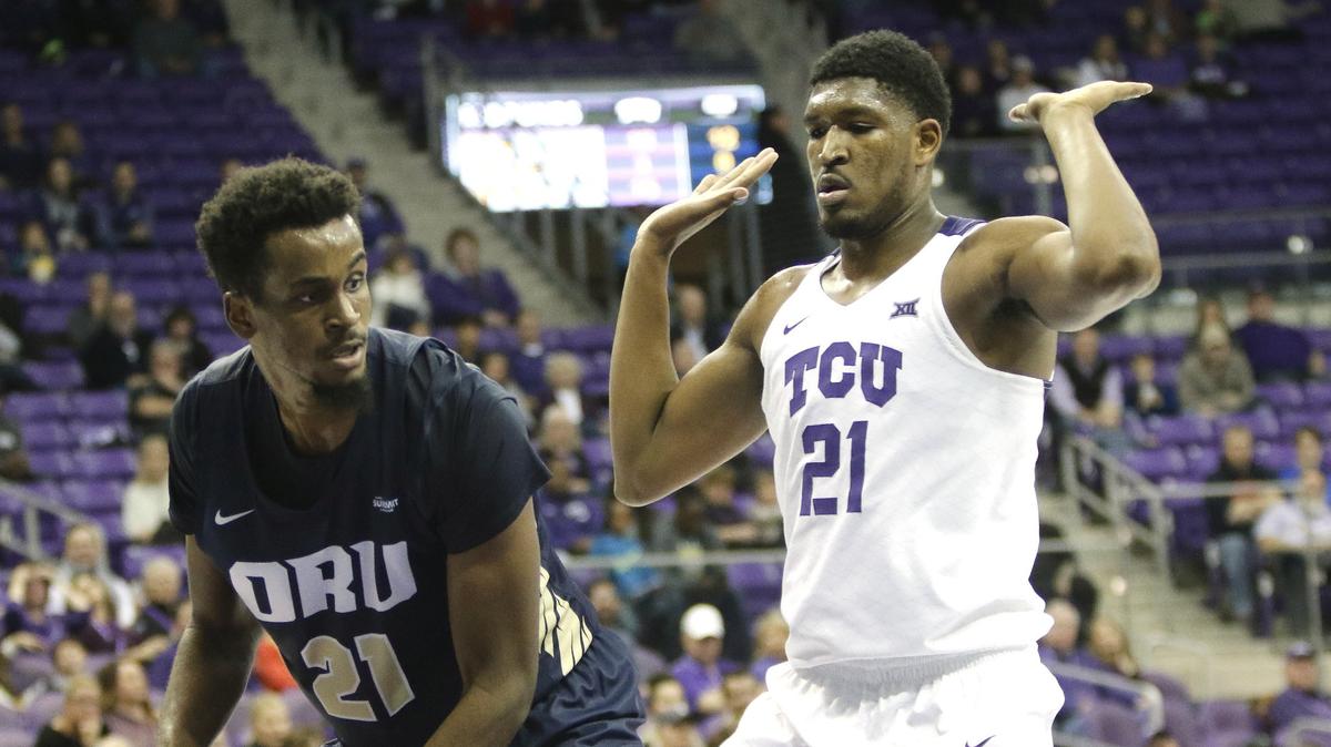 Oral Roberts forward Kerwin Smith (21) grabs a rebound in front of TCU center Kevin Samuel (21) during the first half of a NCAA mens basketball game at Schollmaier Arena in Fort Worth, Texas, Sunday, Nov. 11, 2018. TCU led 37-28 at the half. (Special to the Star-Telegram Bob Booth)