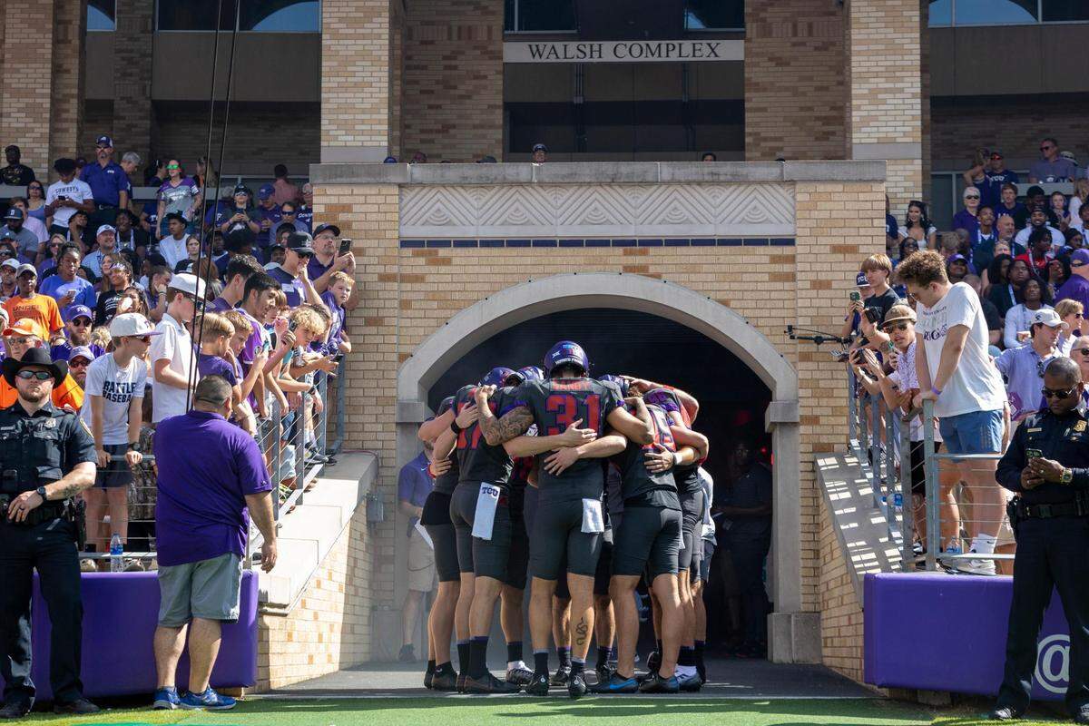 The TCU Horned Frogs football team huddles before the beginning of their game against OSU at the Amon G. Carter Stadium in Fort Worth, on Saturday, Oct. 16, 2022.