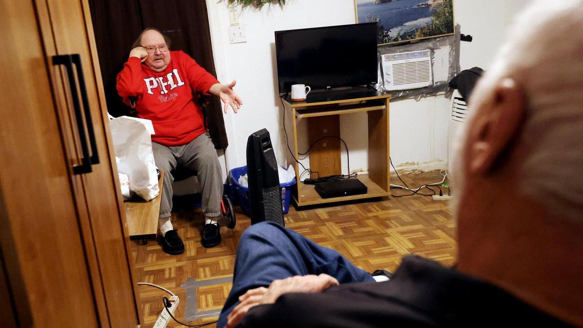 Paul Angstadt, left, visits with David Friant on Monday in Fort Worth. The pair have been participating in the Meals on Wheels “Friend to Friend” program for the last four years.
