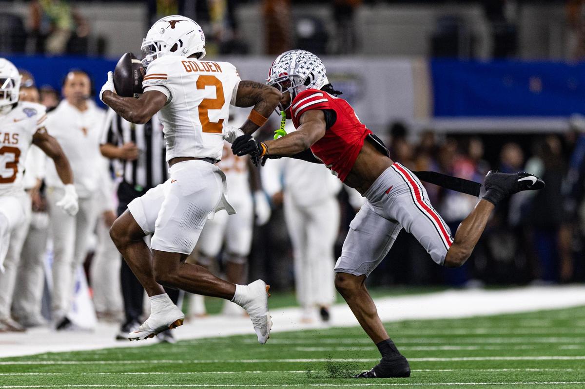 Texas wide receiver Matthew Golden (2) catches a one handed pass from quarterback Quinn Ewers (3) in the first quarter of the College Football Playoff semifinal game between Ohio State and Texas at AT&T Stadium in Arlington on Friday, Jan. 10, 2025.