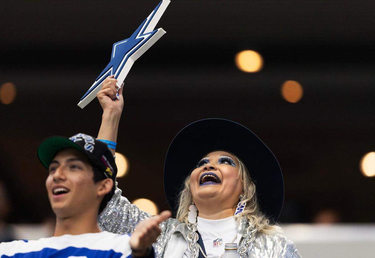 A Cowboys fan cheers on the team against the New York Jets on Sunday, September 17, 2023, at AT&T Stadium in Arlington.