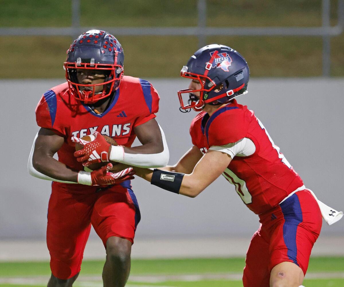 Northwest quarterback Trey Poe (10) hands the ball to running back Nate Jean (9) during a District 4 6A football game at Northwest ISD Stadium in Justin, Texas, Thursday, Oct. 17, 2024.