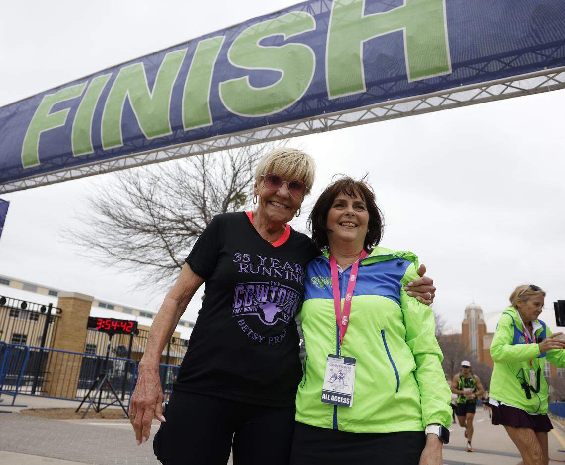 Former Fort Worth Mayor Betsy Price received a T-shirt from Heidi Swartz for running the Cowtown for 35 years during the 48th running of the Cowtown Marathon on Sunday at the Will Rogers Memorial Center in Fort Worth.