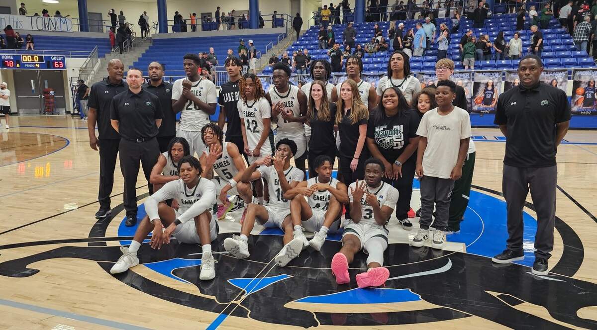 The Mansfield Lake Ridge boys basketball team poses after defeating Waxahachie 78-63 in a Class 5A Region II quarterfinal on Monday, February 26, 2024 at Midlothian High School in Midlothian, Texas.