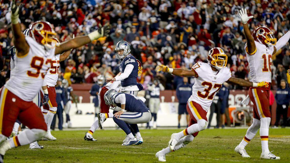 Washington Redskins’ Jonathan Allen, Greg Stroman, Jehu Chesson celebrate after Dallas Cowboys kicker Brett Maher missed a 52-yard field goal attempt at the end of regulation on Sunday.
