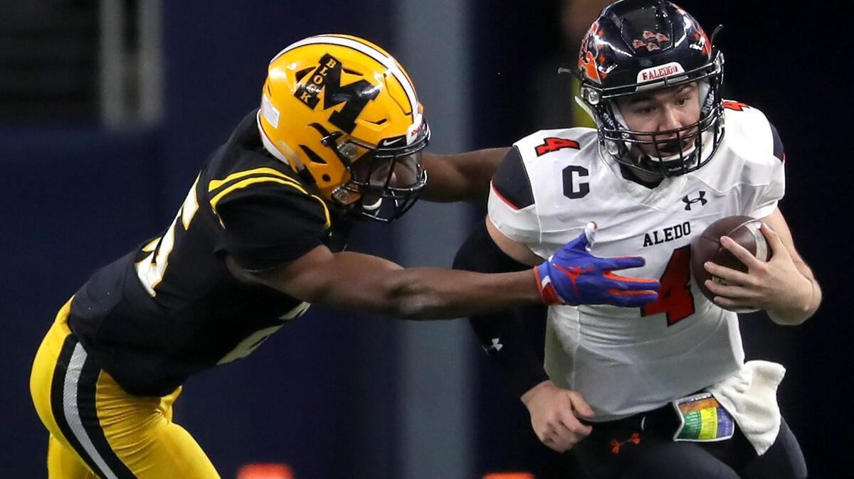 Aledo quarterback Jake Bishop (4) tries to get past defensive back Avery Helm (25) during the first half of the 5A Division II High School State Football Championship game played at AT&T Stadium in Arlington, TX, Saturday, December 21, 2019. Helm transferred to TCU after three seasons at Florida.