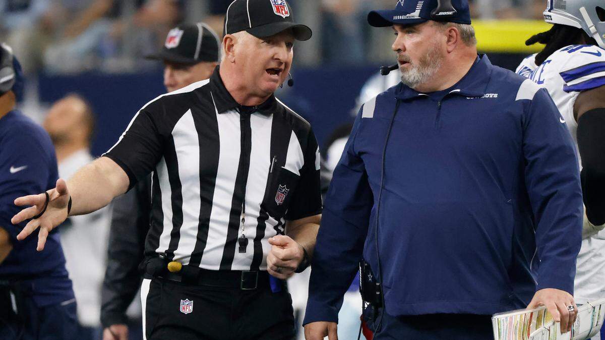 Dallas Cowboys head coach Mike McCarthy talks with line judge Mark Stewart in the Jan. 16, 2022, loss to the San Francisco 49ers in an NFL wild-card playoff football game in AT&T Stadium. 