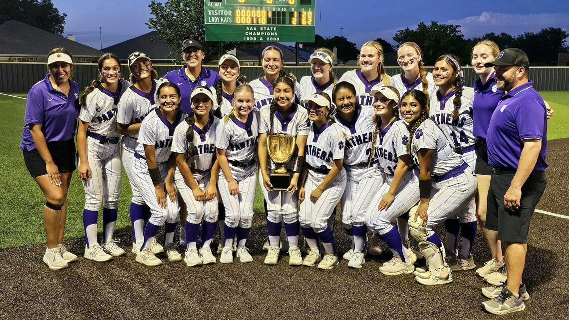 The Fort Worth Paschal softball team poses with hardware after defeating Cleburne in a Class 5A Division I bi-district game on Friday, April 24, 2026 at Wildcat Field in Kennedale, Texas.