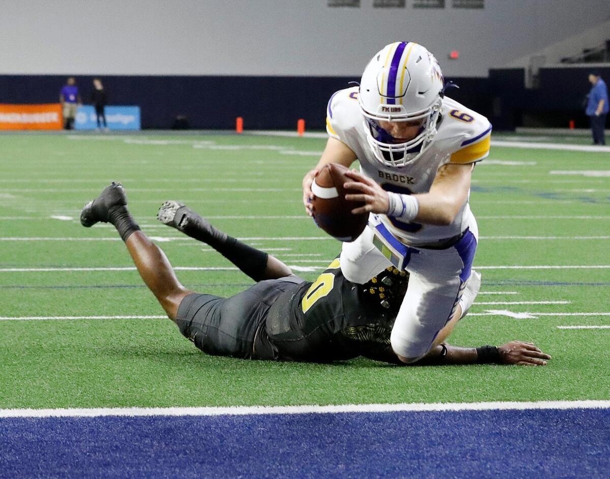 Brock quarterback Tyler Moody (6) extends the ball for the Eagles first touchdown in the first half of a UIL Class 3A D1 state semifinal football game at the Ford Center in Frisco, Texas, Thursday, Dec. 08, 2022. Brock led Malakoff 14-3 at the half. (Special to the Star-Telegram Bob Booth)