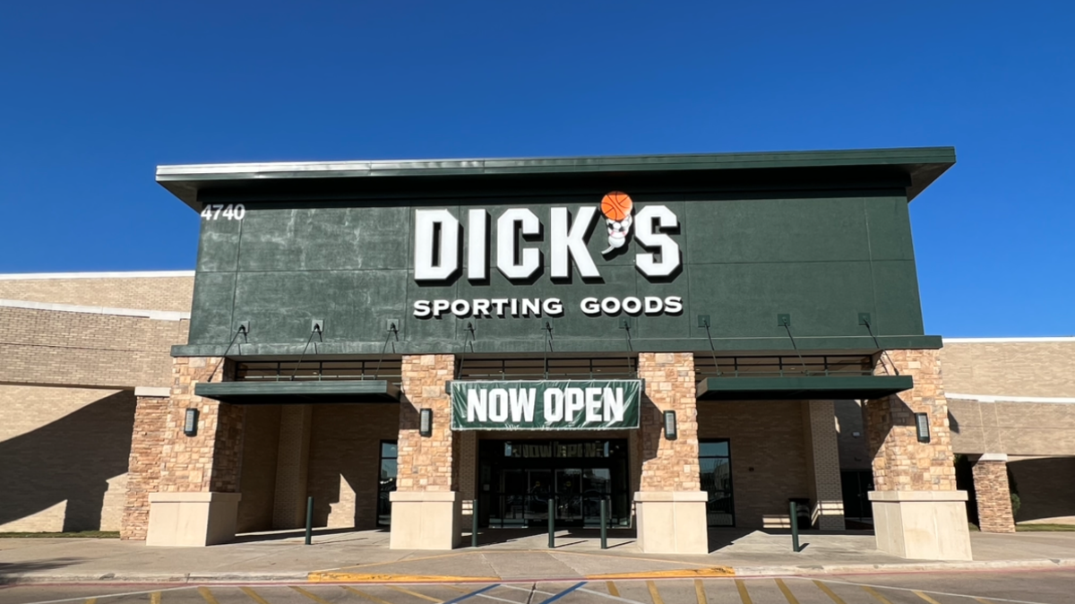The front of the DICK's Sporting Goods store in Overton Park Plaza with a "now open" sign above the entrance.