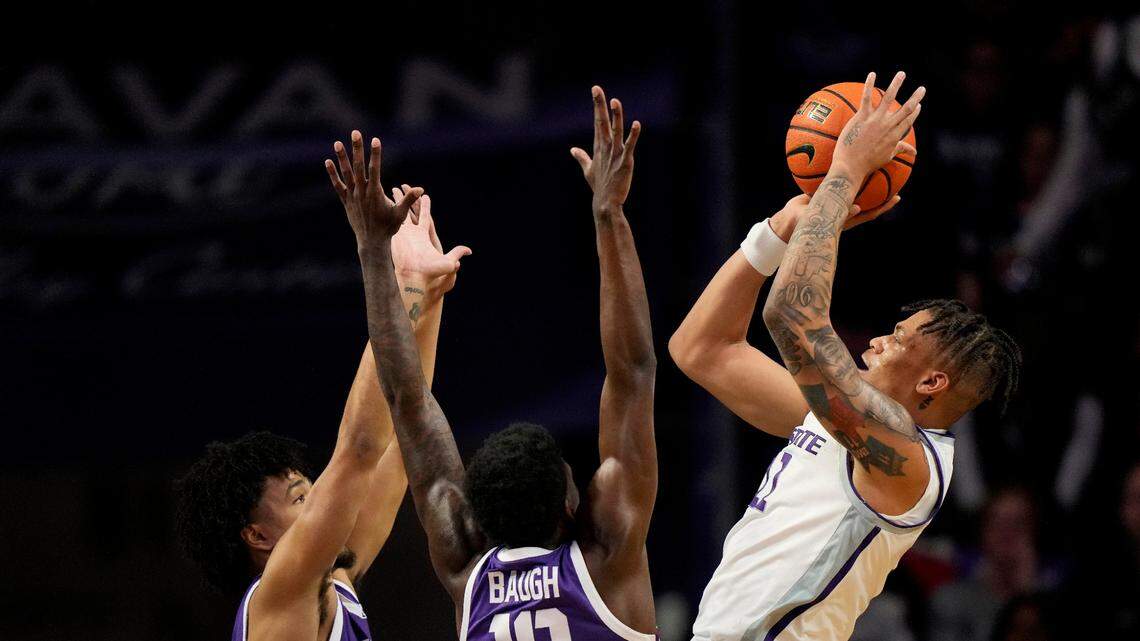 Kansas State forward Keyontae Johnson shoots over TCU guards Damion Baugh (10) and Micah Peavy during the first half on Tuesday in Manhattan, Kan.