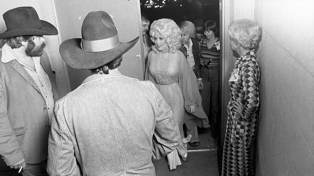 Dec. 2, 1977: Dolly Parton entering Panther Hall in Fort Worth, Texas, with her crew for a concert. There were 1,250 people in the venue’s country music ballroom.