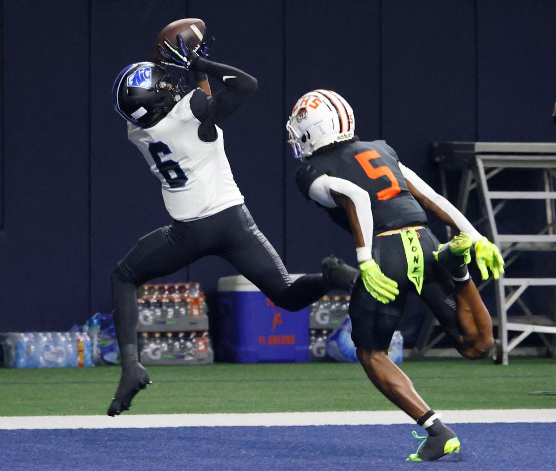 North Crowley wide receiver Quentin Gibson (6) grabs a touchdown pass in front of Lancaster defensive back Braylan McDonald (5) during a UIL football game at The Star in Frisco Texas, Saturday, Oct. 31, 2024.