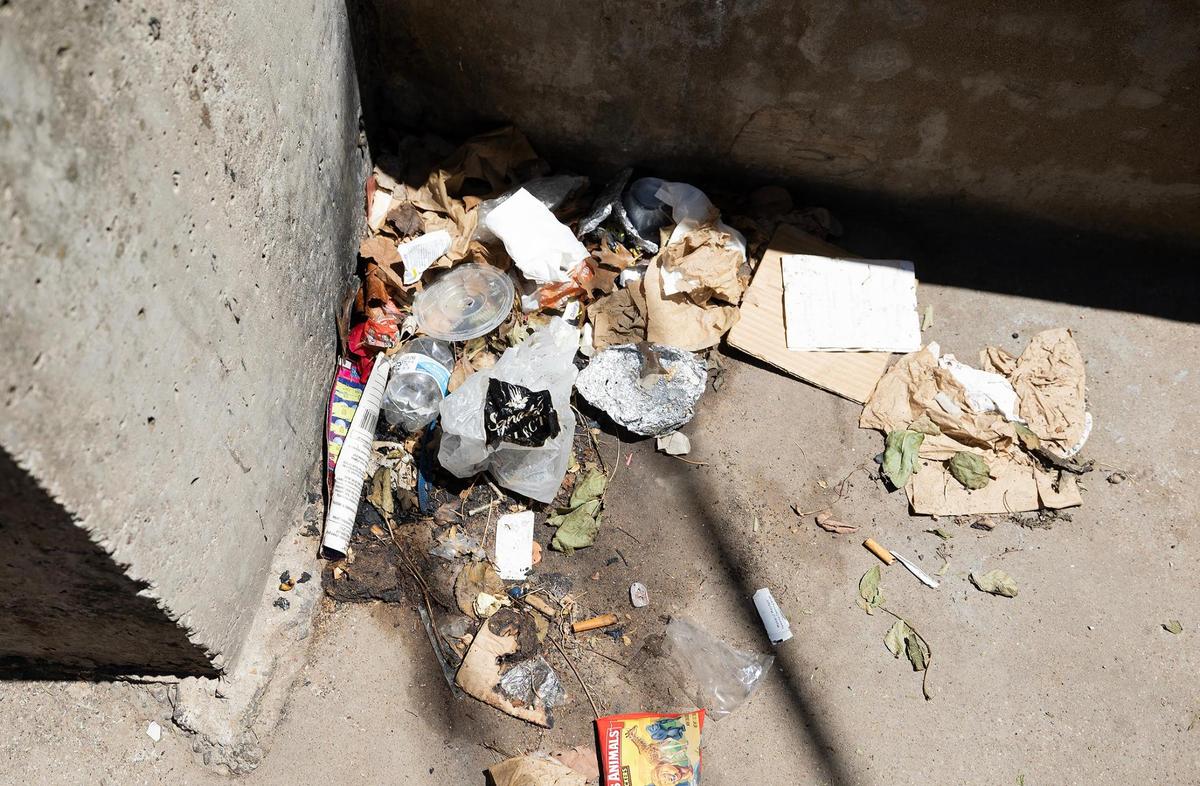 A pile of trash has been left by people using the back of Extra Care Concerns on East Lancaster Street to sleep.