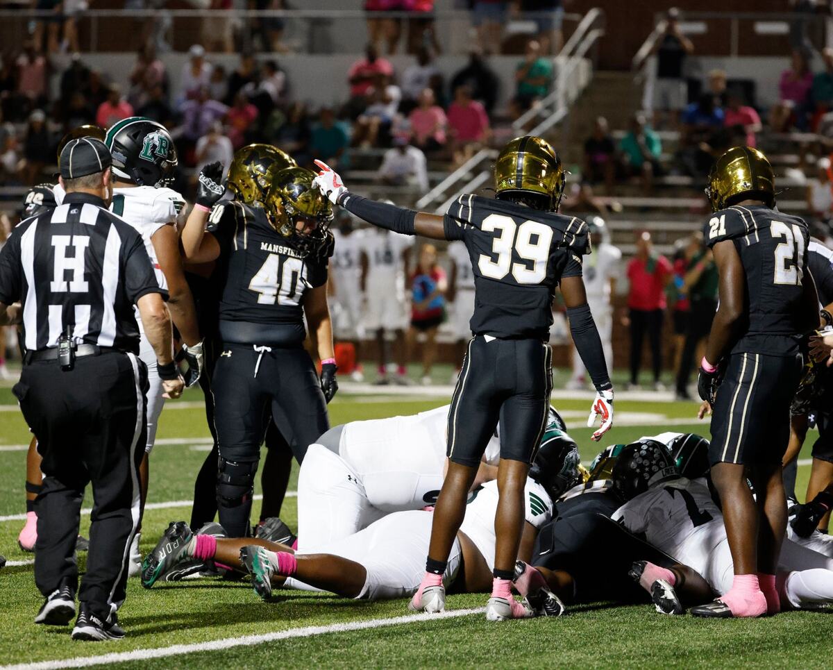 Mansfield defensive back Saadel Davis (39) signals they recovered a Lake Ridge fumble during a UIL football game at Vernon Newsom Stadium in Mansfield Texas, Thursday, Oct. 03, 2024.