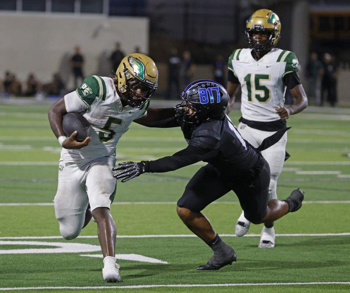 DeSoto running back SaRod Baker (5) gets away from the attempted tackle by North Crowley linebacker Avery Dotson (11) during the first half of a UIL football game between DeSoto and North Crowley at Crowley ISD Multi-Purpose Stadium in Fort Worth, Texas, Friday, Sept. 05, 2025.