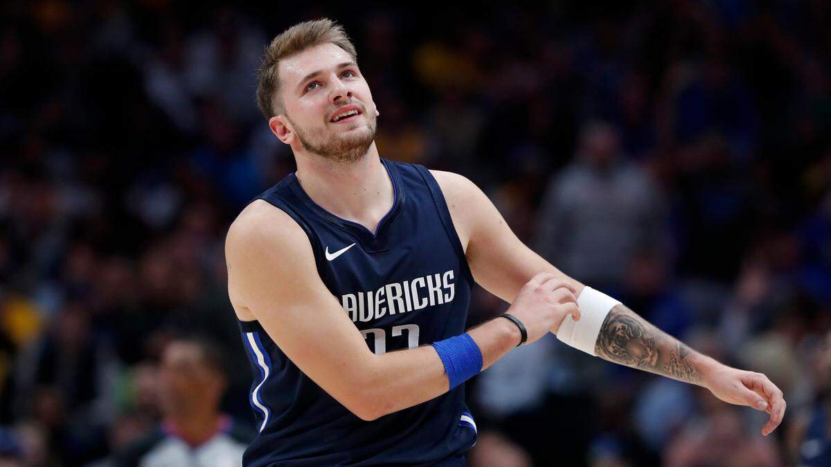 Luka Doncic scored a game-high 32 points but the Dallas Mavericks lost their season opener to the Phoenix Suns at Phoenix Suns Arena Wednesday night.