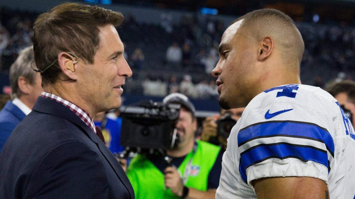 Dallas Cowboys quarterback Dak Prescott shakes hands with Hall of Famer Steve Young following the Cowboys’ win over the Detroit Lions at AT&T Stadium, Sunday, Dec. 26, 2016.