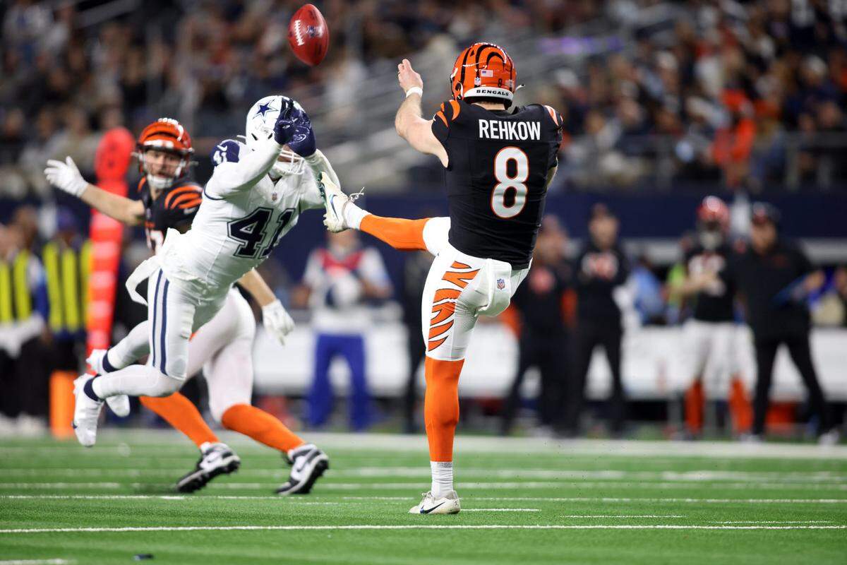 Dallas Cowboys linebacker Nick Vigil (41) blocks a punt by Cincinnati Bengals punter Ryan Rehkow (8) in the fourth quarter at AT&T Stadium. The Bengals eventually recovered the ball, setting up the game-winning touchdown.