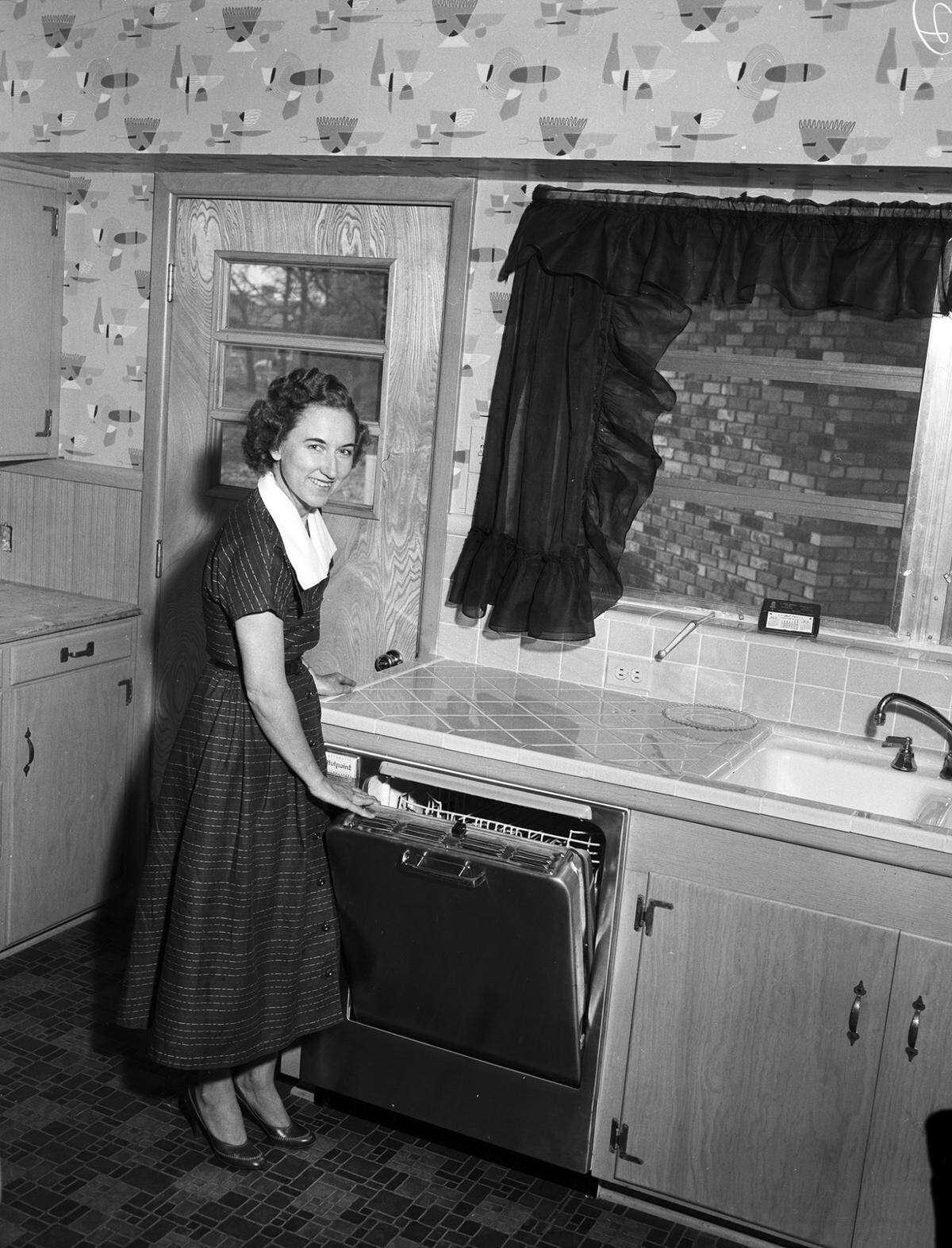 April 5, 1955: Mrs. Max W. Martin in the kitchen of the family residence, 5628 Blueridge Drive, Fort Worth.