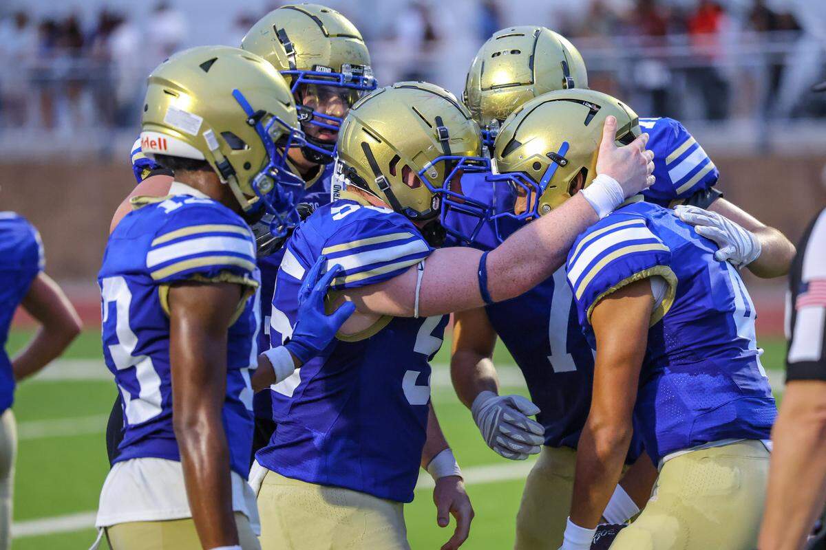 Boswell’s Tyler Reyes (4) celebrates his touchdown with teammates against Saginaw Friday at Boswell Pioneer Stadium. Special to the Star-Telegram / Tom Marvin