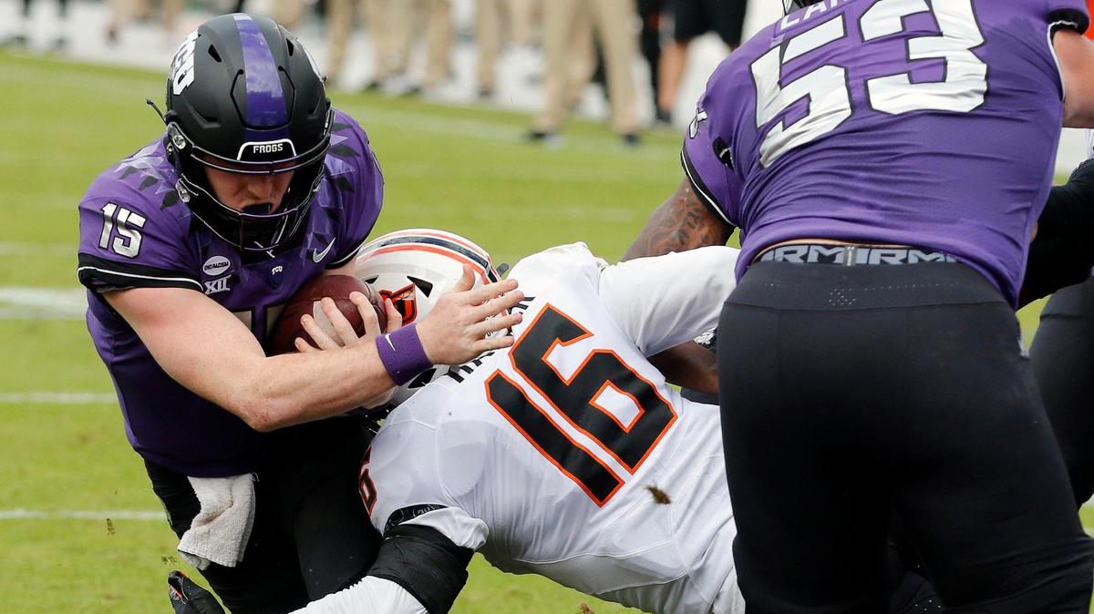 TCU quarterback Max Duggan (15) takes the ball in for their only score in the first half of a NCAA football game at Amon G. Carter Stadium in Fort Worth, Texas, Saturday, Dec. 05, 2020. The OSU Cowboys led 16-7 at the half. (Special to the Star-Telegram Bob Booth)