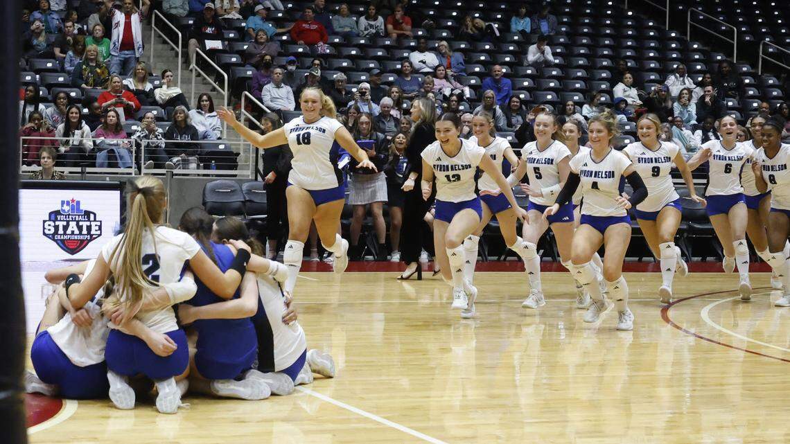 Trophy Club Byron Nelson Lady Cats rush the court after defeating Pearland Dawson in the UIL Class 6A Division I state volleyball championship game Saturday Nov. 22, 2025 at Curtis Culwell Center in Garland, Texas.