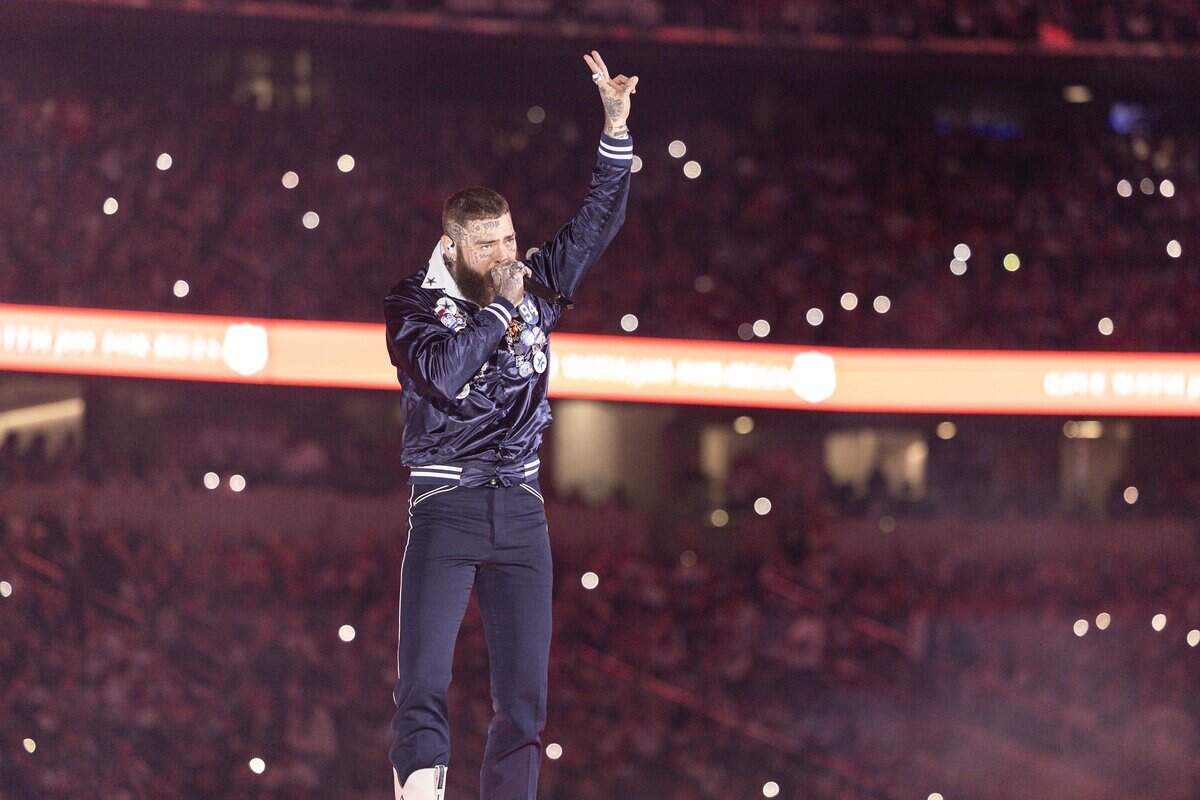 Post Malone performs for the halftime show of the Thanksgiving NFL game between the Dallas Cowboys and the Kansas City Chiefs at AT&T Stadium in Arlington on Thursday, Nov. 27, 2025.