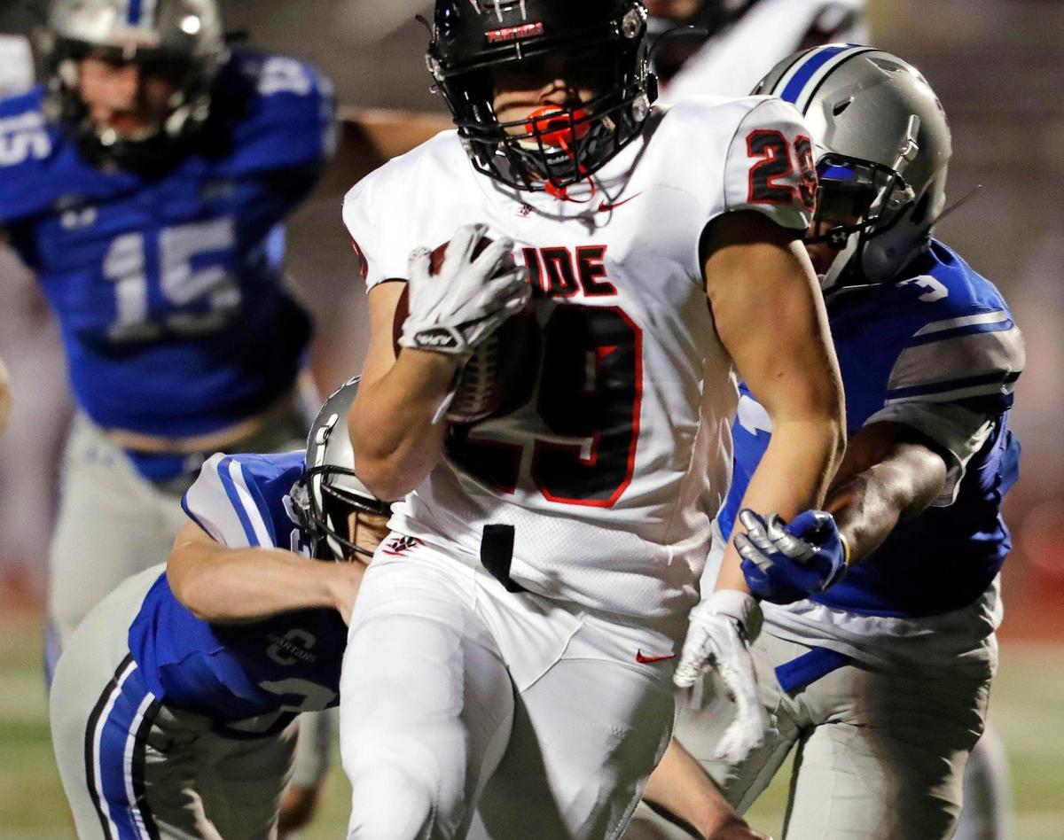 Colleyville Heritage running back Braxton Ash (29) breaks through the middle for their second touchdown of the half during a 5A high school football game at Burleson ISD Stadium in Burleson , Texas, Friday, Nov. 27, 2020. Colleyville led 17-0 at the half. (Special to the Star-Telegram Bob Booth)