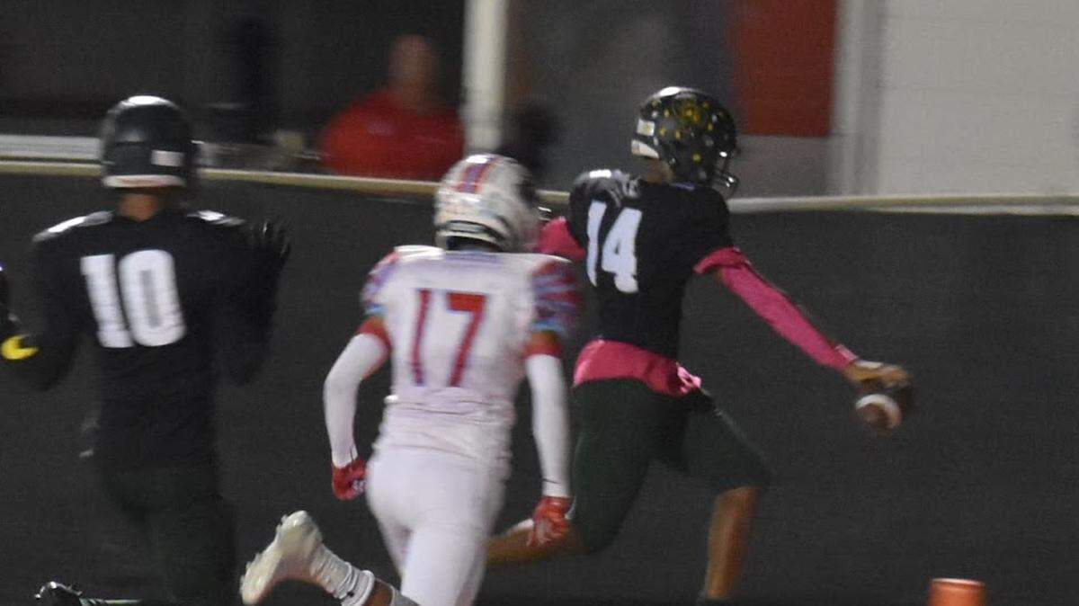 Keyon Butler (14) scores for Western Hills during a high school football game against Castleberry at Scarborough-Handley Field in Fort Worth, Texas, Thursday, October 13, 2022. Western Hills won 50-35. (Olivia Luttrell/Special to the Star-Telegram)