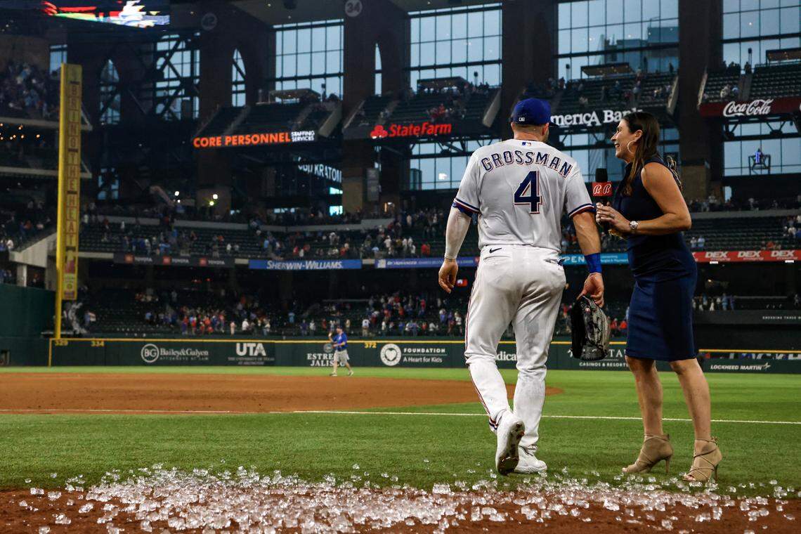 Rangers outfielder Robbie Grossman is dumped with ice after winning against the Phillies on March 30, 2023, at Globe Life Field in Arlington. Texas beat Philadelphia 11-7.