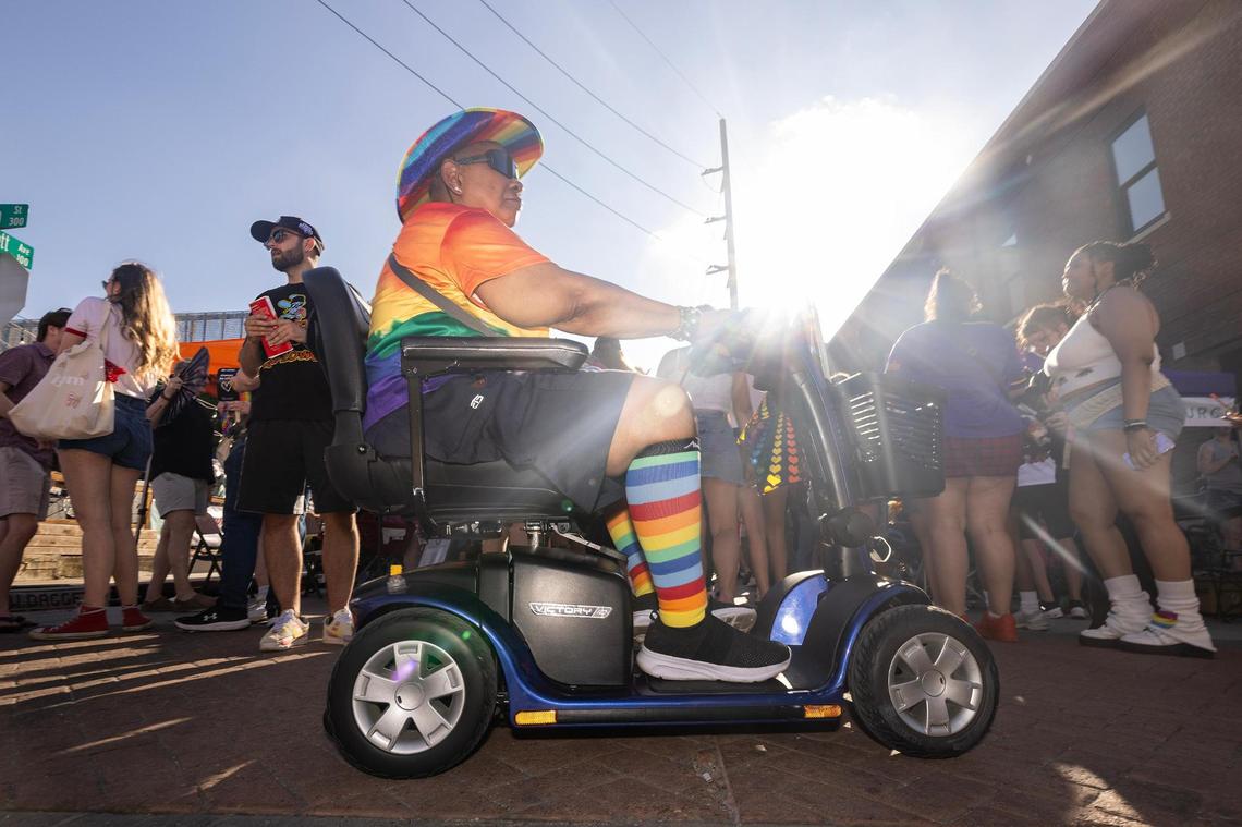 Fort Worth resident Maxine Sneed heads past the vendors during Trinity Pride Fest on South Main Street in Fort Worth on Saturday, June 28, 2025.
