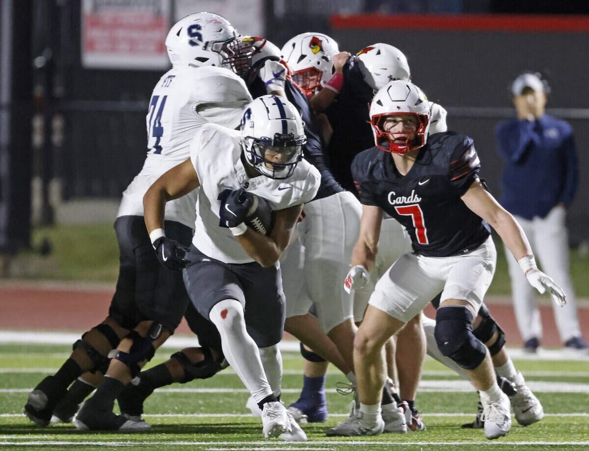 All Saints running back Jourden Billings (10) breaks through the line in front of Fort Worth Christian linebacker Cort Williams (7) during the second half of a TAPPS football game between Fort Worth All Saints and Fort Worth Christian at Barrow Field in North Richland Hills, Texas, Friday, October 31, 2025.