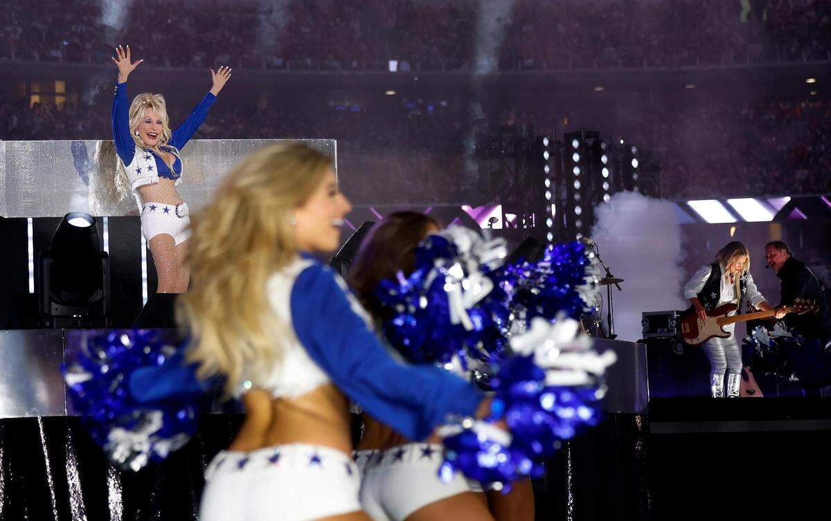 Dolly Parton performs during the Dallas Cowboys’ halftime show to kickoff the Red Kettle Campaign on Thursday, November 23, 2023, at AT&T Stadium in Arlington.