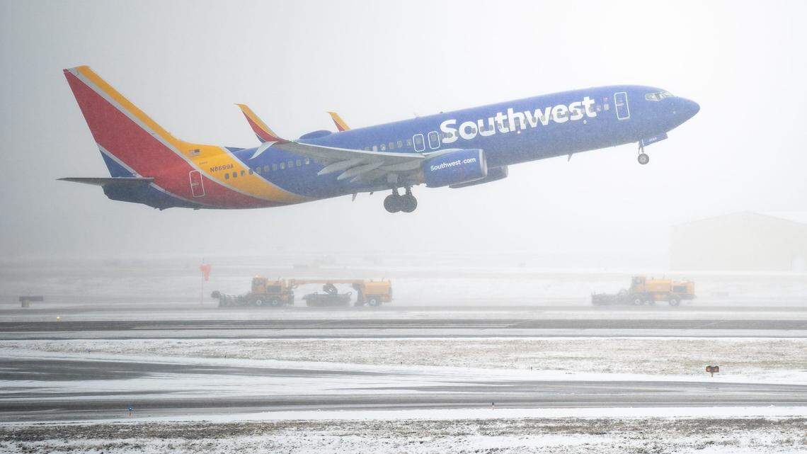 A Southwest Airlines flight departs as plows clear snow at Nashville International Airport in Nashville, Tenn., Friday, Jan. 10, 2025.