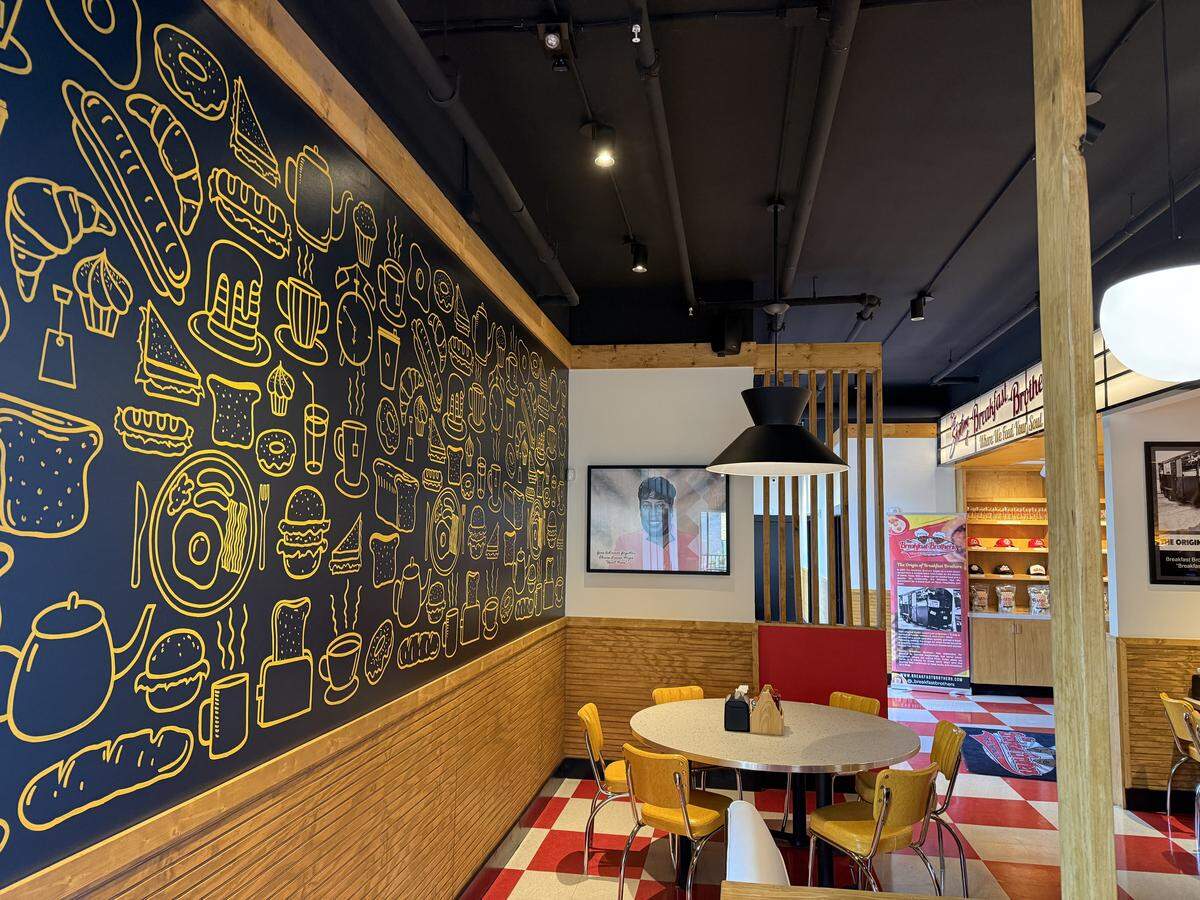 Artworks cover the walls at the Breakfast Brothers in downtown Arlington, Texas, a destination breakfast restaurant, seen Oct. 25, 2025.