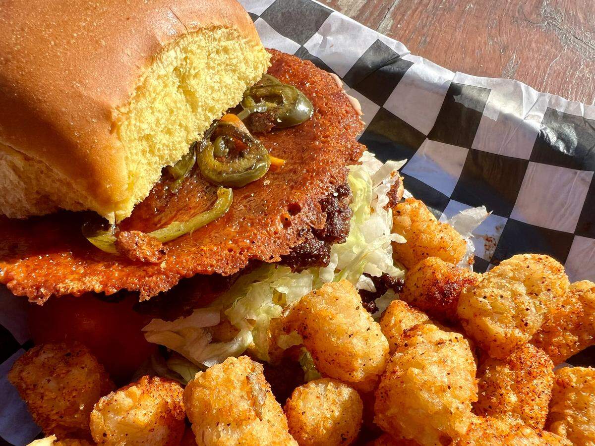 The Mahomes Burger has a Kansas City Chiefs-gold ring of cheese crisp.