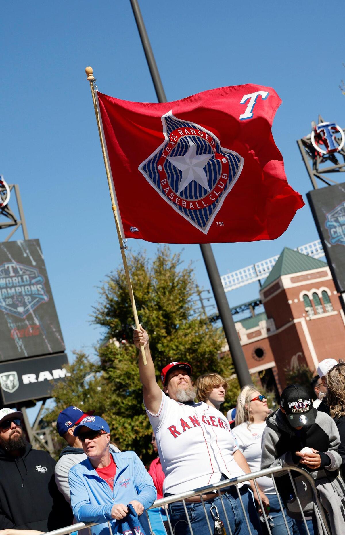 Many fans hoisted Texas Ranger flags during the Texas Rangers World Series Parade in Arlington, Texas, Friday, Nov. 03, 2023. (Special to the Star-Telegram Bob Booth)