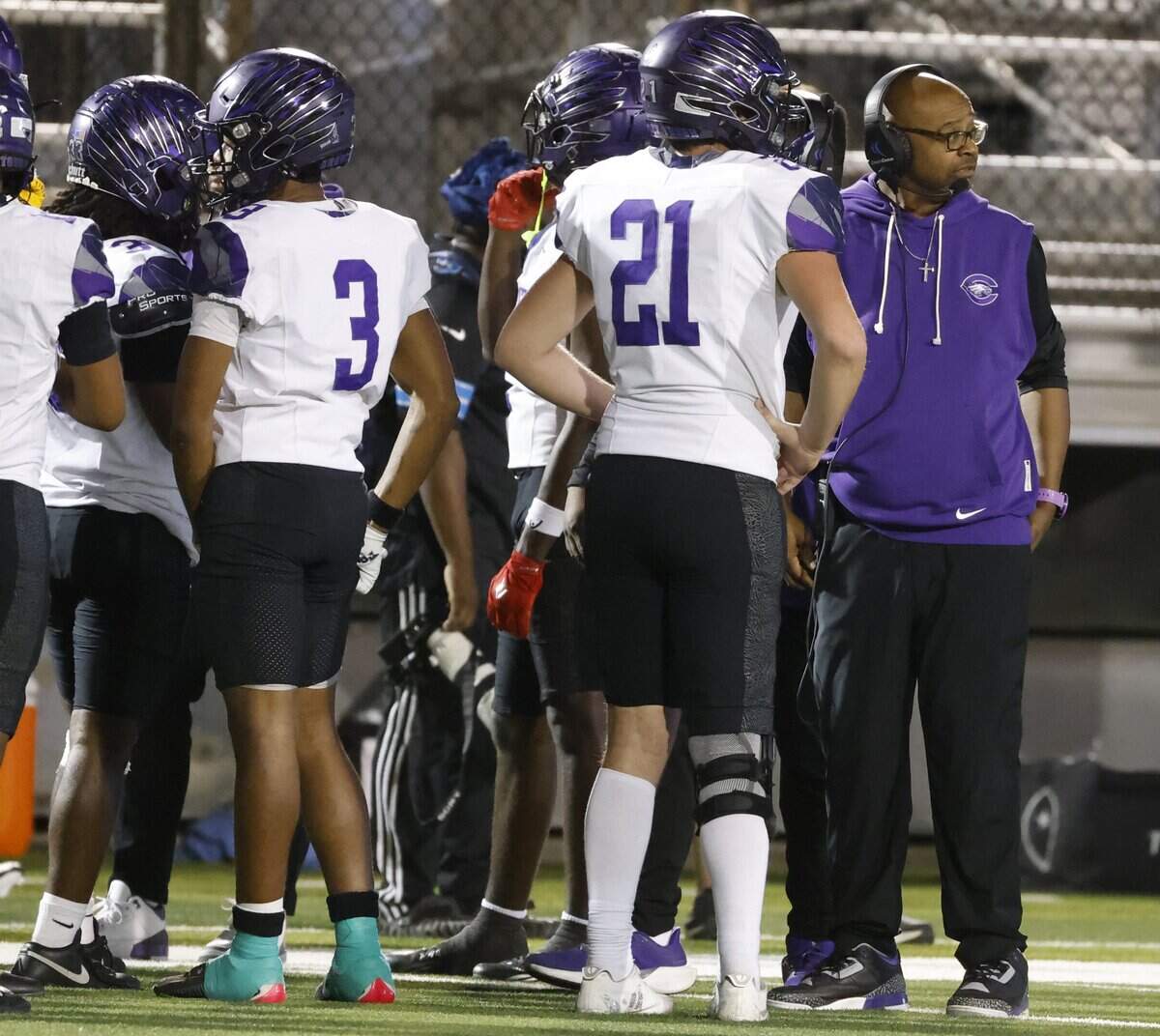 Crowley head coach Carlos Lynn glances toward the score board with a few minutes remaining of during the second half of a UIL Conference 6A D2 Bi-District playoff game between Crowley and Southlake Carroll at Dragon Stadium in Southlake, Texas, Thursday, Nov. 13, 2025.
