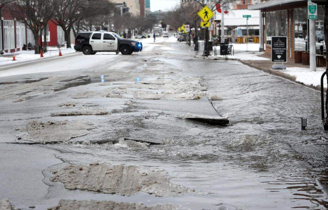 Water gushes from a water main break at the 1200 block of West Magnolia Avenue on Feb. 18, 2021.