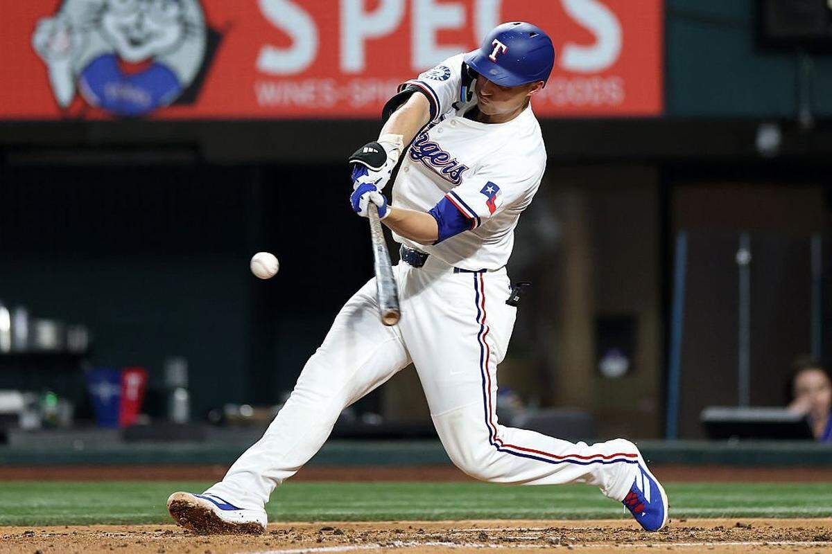 ARLINGTON, TEXAS - AUGUST 26: Corey Seager #5 of the Texas Rangers hits a home run against the Los Angeles Angels during the seventh inning at Globe Life Field on August 26, 2025 in Arlington, Texas. (Photo by Stacy Revere/Getty Images)