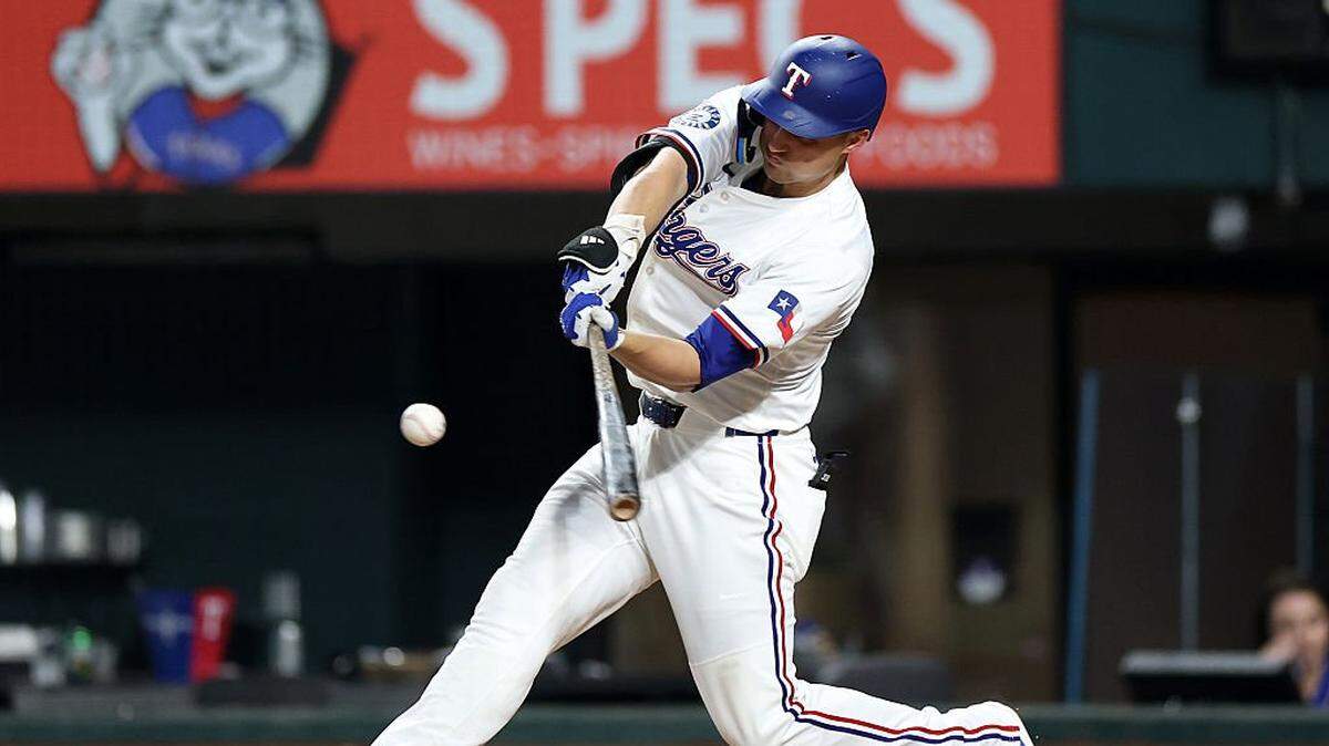ARLINGTON, TEXAS - AUGUST 26: Corey Seager #5 of the Texas Rangers hits a home run against the Los Angeles Angels during the seventh inning at Globe Life Field on August 26, 2025 in Arlington, Texas. (Photo by Stacy Revere/Getty Images)