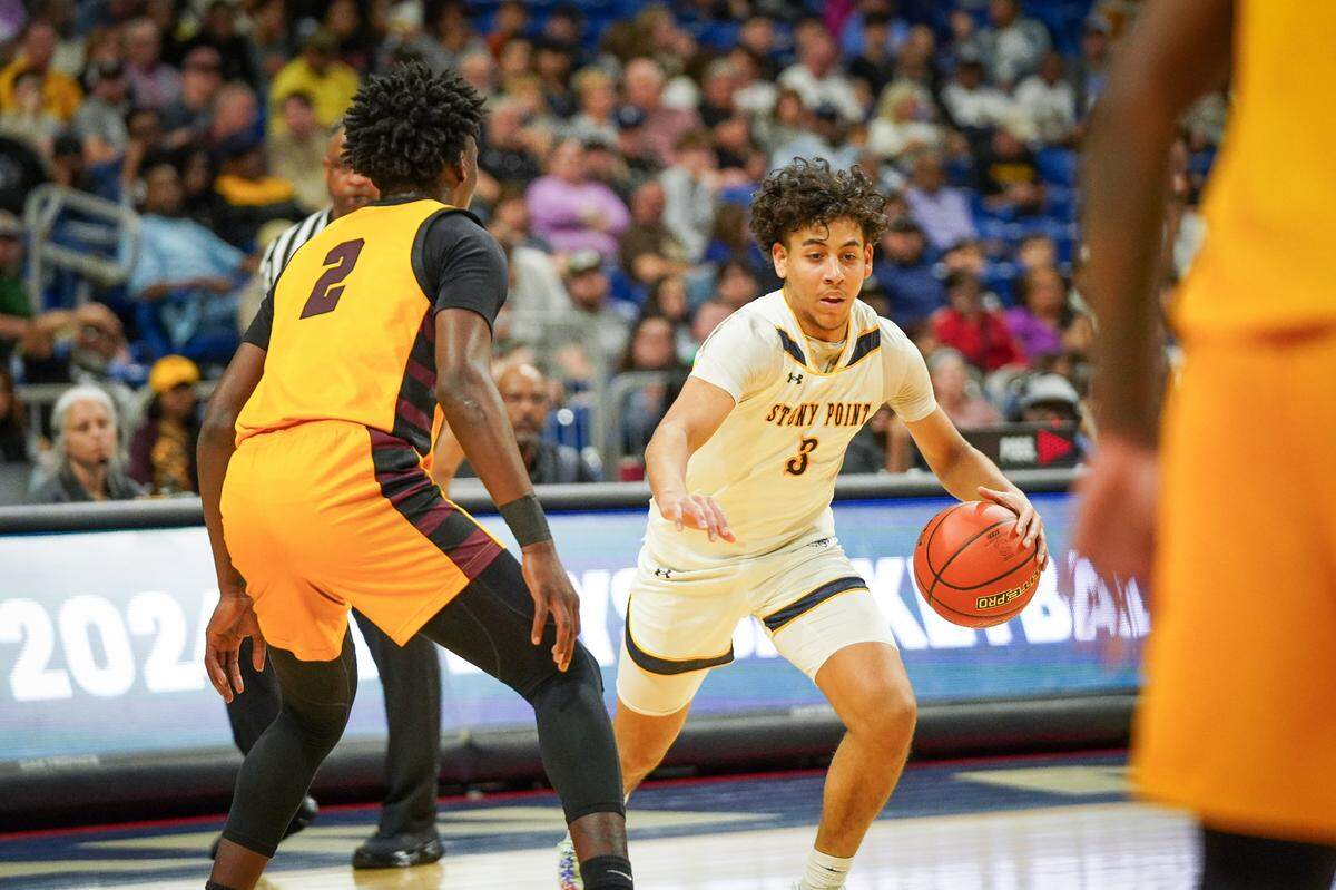 Round Rock Stony Point guard Macharold Goodlet looks for room against Malachi Anderson of Beaumont United in a Class 6A state semifinal on Friday, March 8, 2024 at the Alamodome in San Antonio, Texas. Stony Point downed United 54-46.