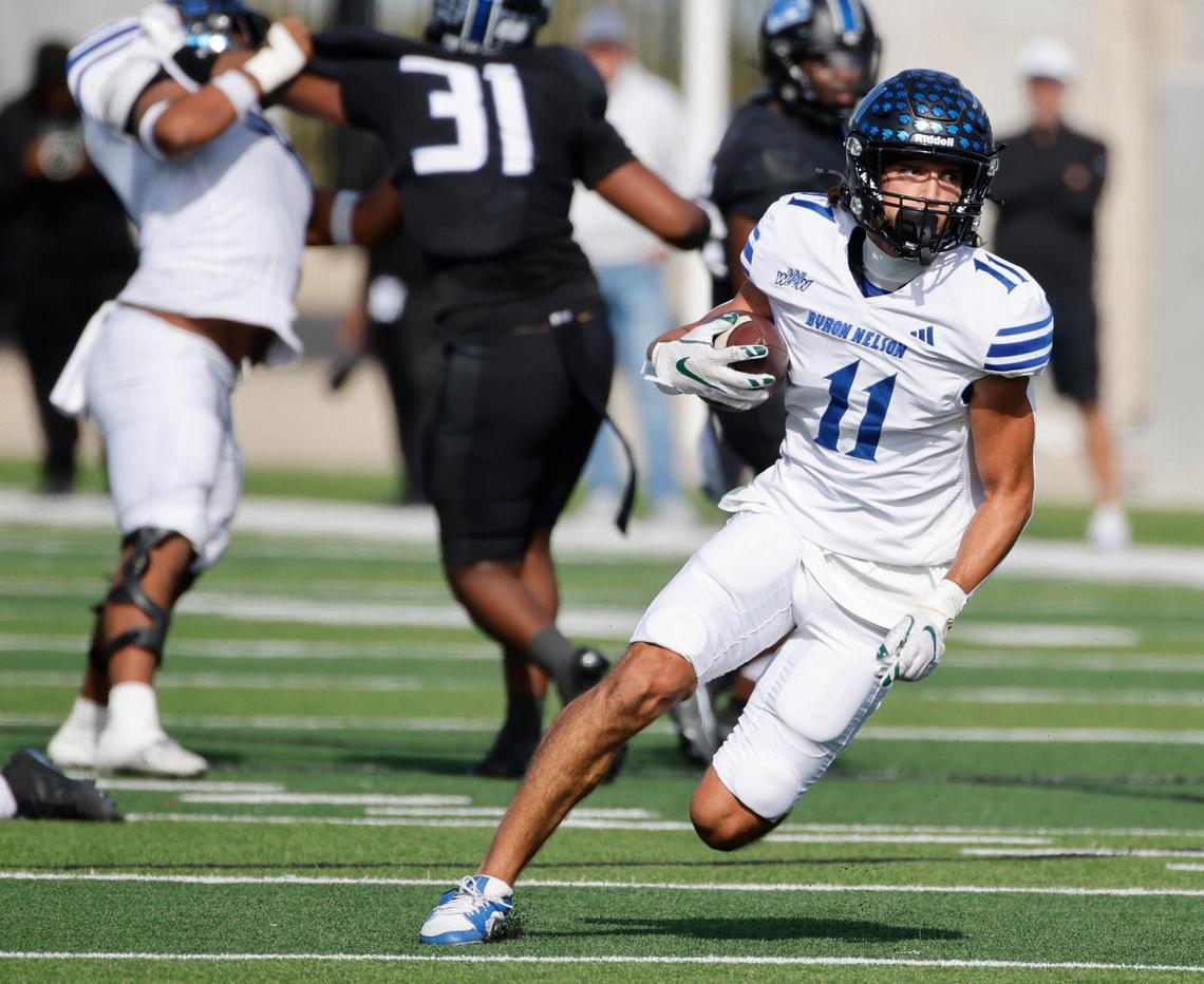 Trophy Club Byron Nelson wide receiver Leo Almanza (11) puts up yards after the catch against North Crowley during a UIL Class 6A D1 Bi-district playoff football game at Crowley ISD Multi-Purpose Stadium in Fort Worth, Texas, Saturday, Nov. 16, 2024.