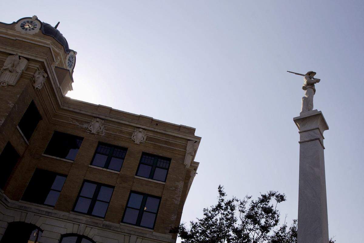 A monument to the confederate soldier stands in front of the courthouse in Gainesville.