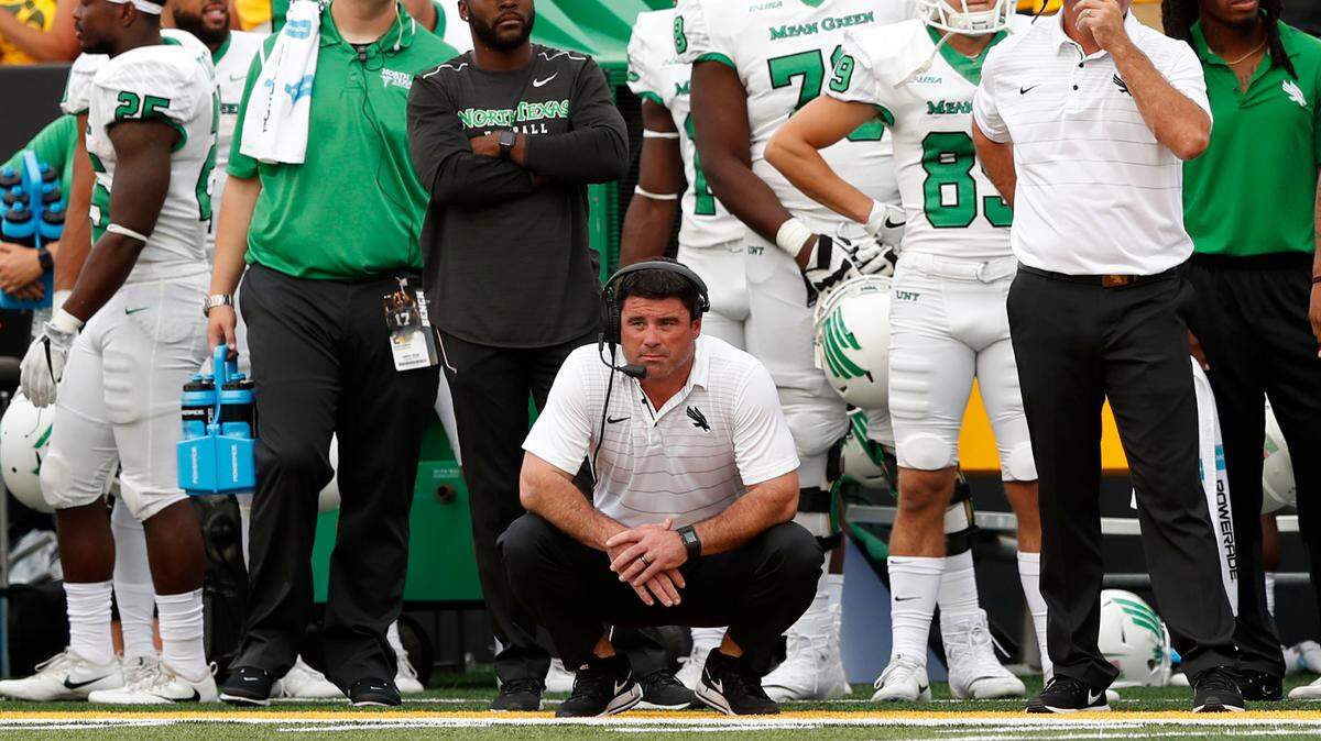 North Texas head football coach Seth Littrell (center) watches from the sideline during the second half of an NCAA college football game against Iowa, Saturday, Sept. 16, 2017, in Iowa City, Iowa. (AP Photo/Charlie Neibergall)