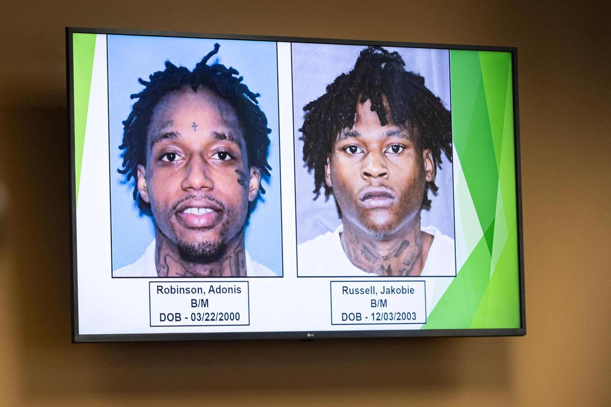 A picture of the two suspects, Adonis Robinson, left, and Jakobie Russell, who are wanted on capital murder charges in the killings of Ronnie Sibley and his daughter R’mani, 5, was shown at Forest Hill City Hall on Wednesday, March 5. Police say Robinson was arrested on Thursday.