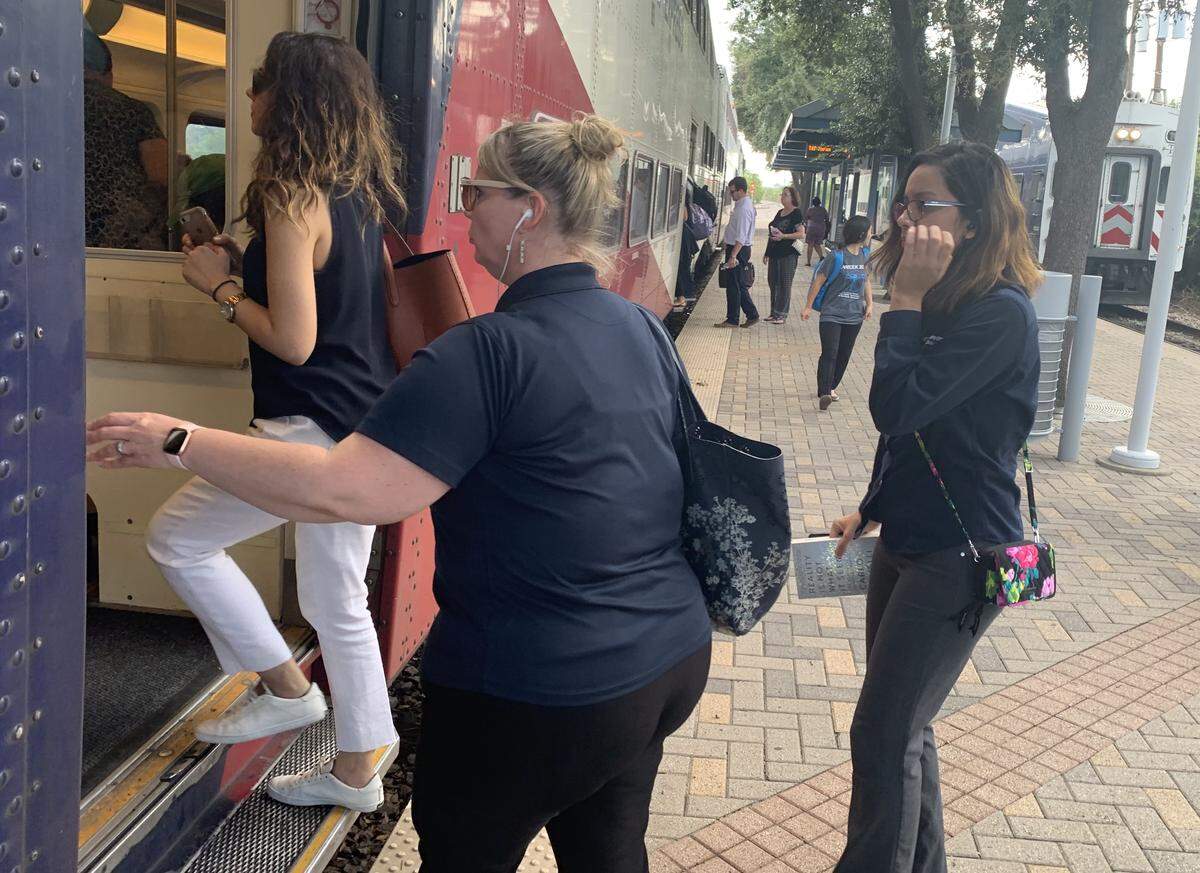 Trinity Railway Express passengers, many of whom work at UT-Southwestern Medical Center in Dallas but live in Tarrant County, board a train at Medical Market Center Station for an afternoon ride home.
