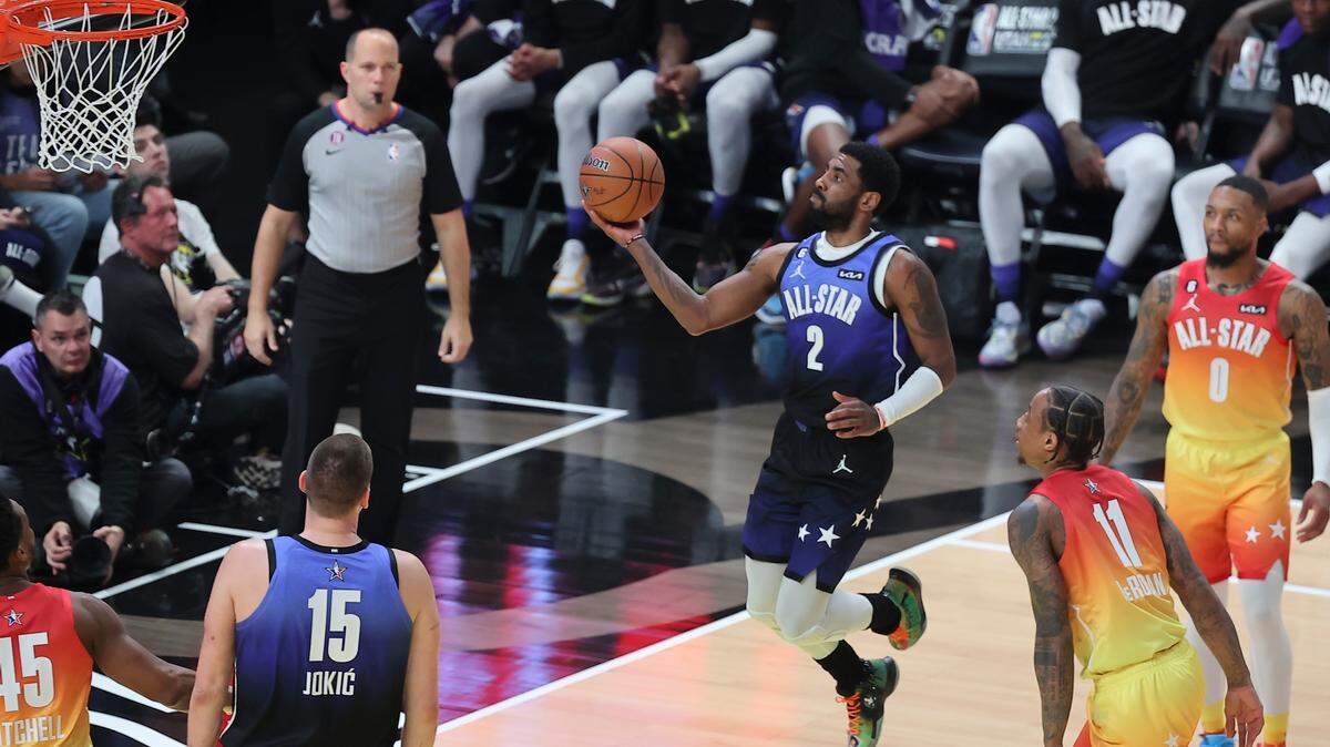 Team LeBron guard Kyrie Irving (2) shoots during the first half of the NBA basketball All-Star game Sunday, Feb. 19, 2023, in Salt Lake City.