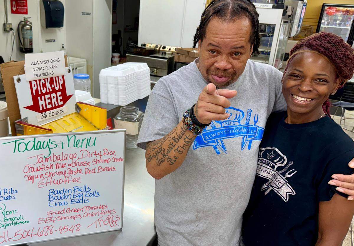Damian Crockem, left, moved from New Orleans two years ago to join now-wife Christina and open Always Cooking NOLA, a Cajun take-out stand in a River Oaks gas station grill, shown June 1, 2024.